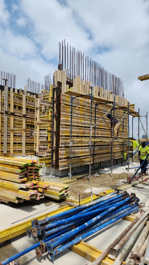 Construction manager overseeing a busy building site.