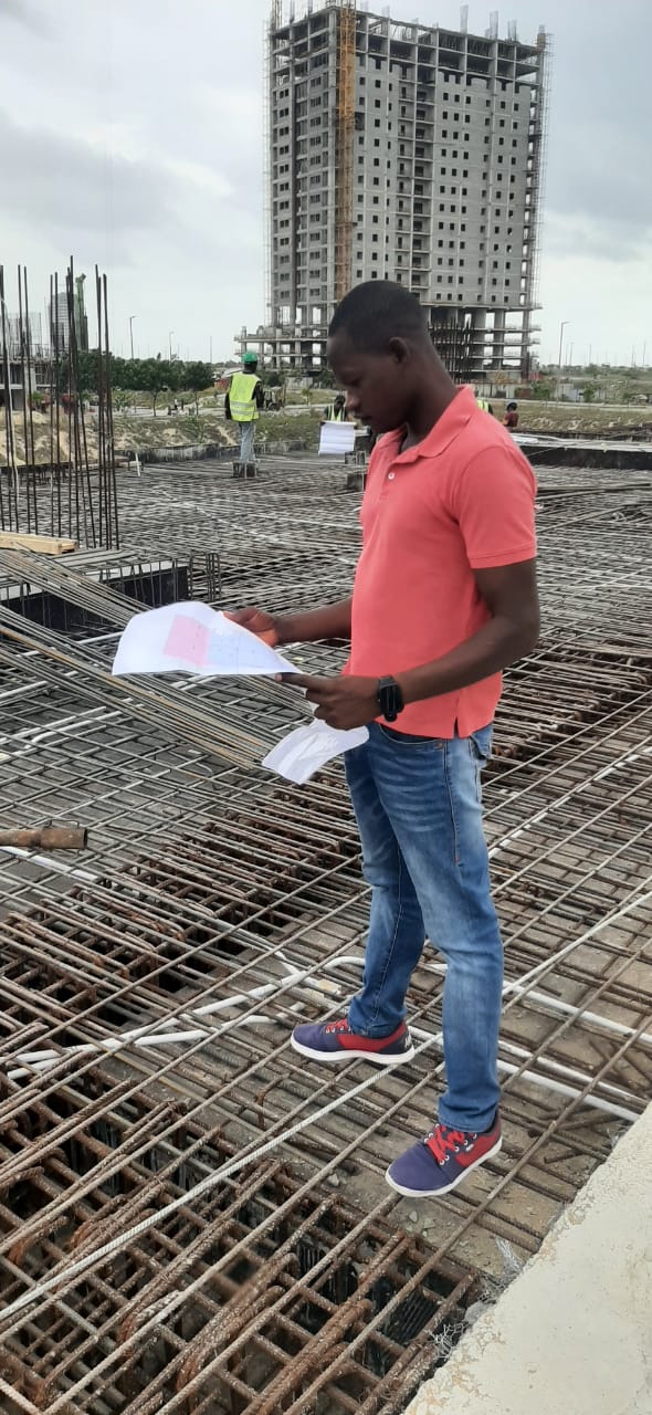Project manager using a tablet on a construction site.